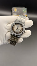 Silver with grey Dial.