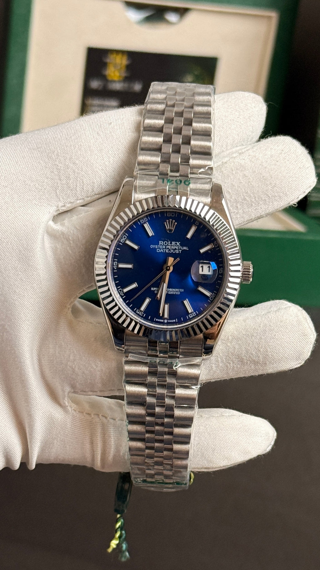 Silver with blue Dial.