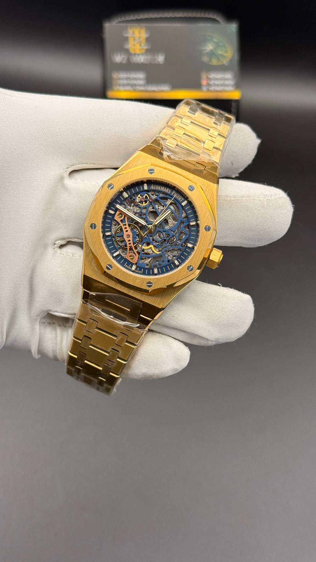 Yellow gold with blue skeleton Dial.