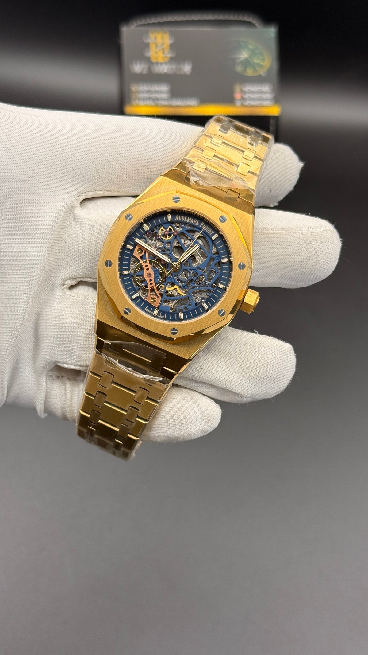 Yellow gold with blue skeleton Dial.