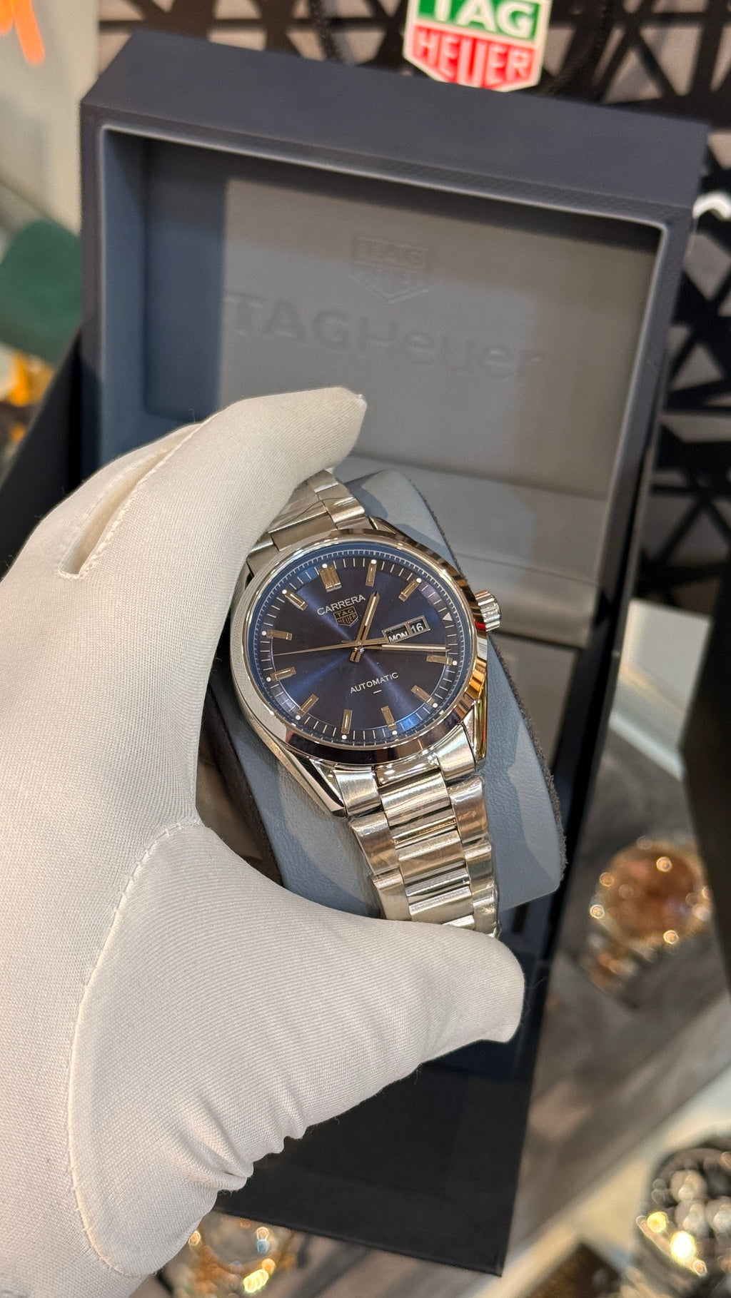 Silver with blue Dial.