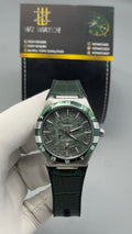 Silver with Green Dial.