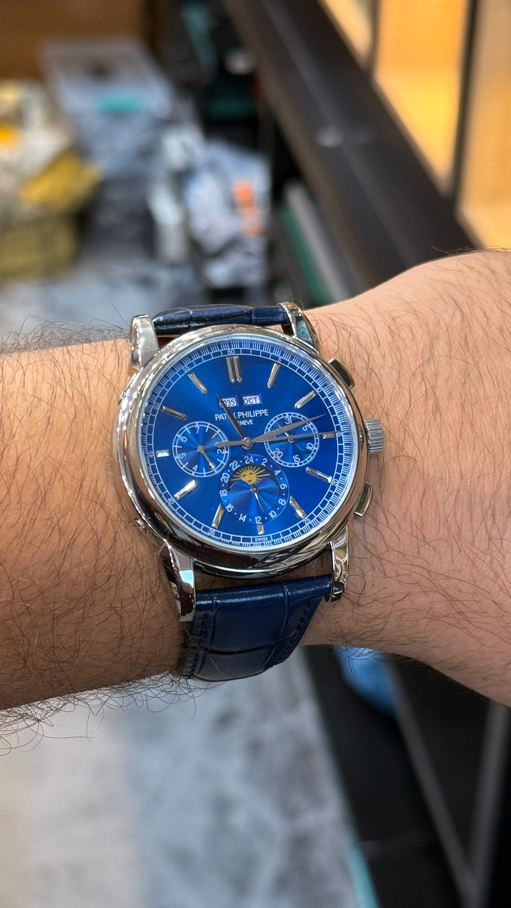 Silver with blue Dial.