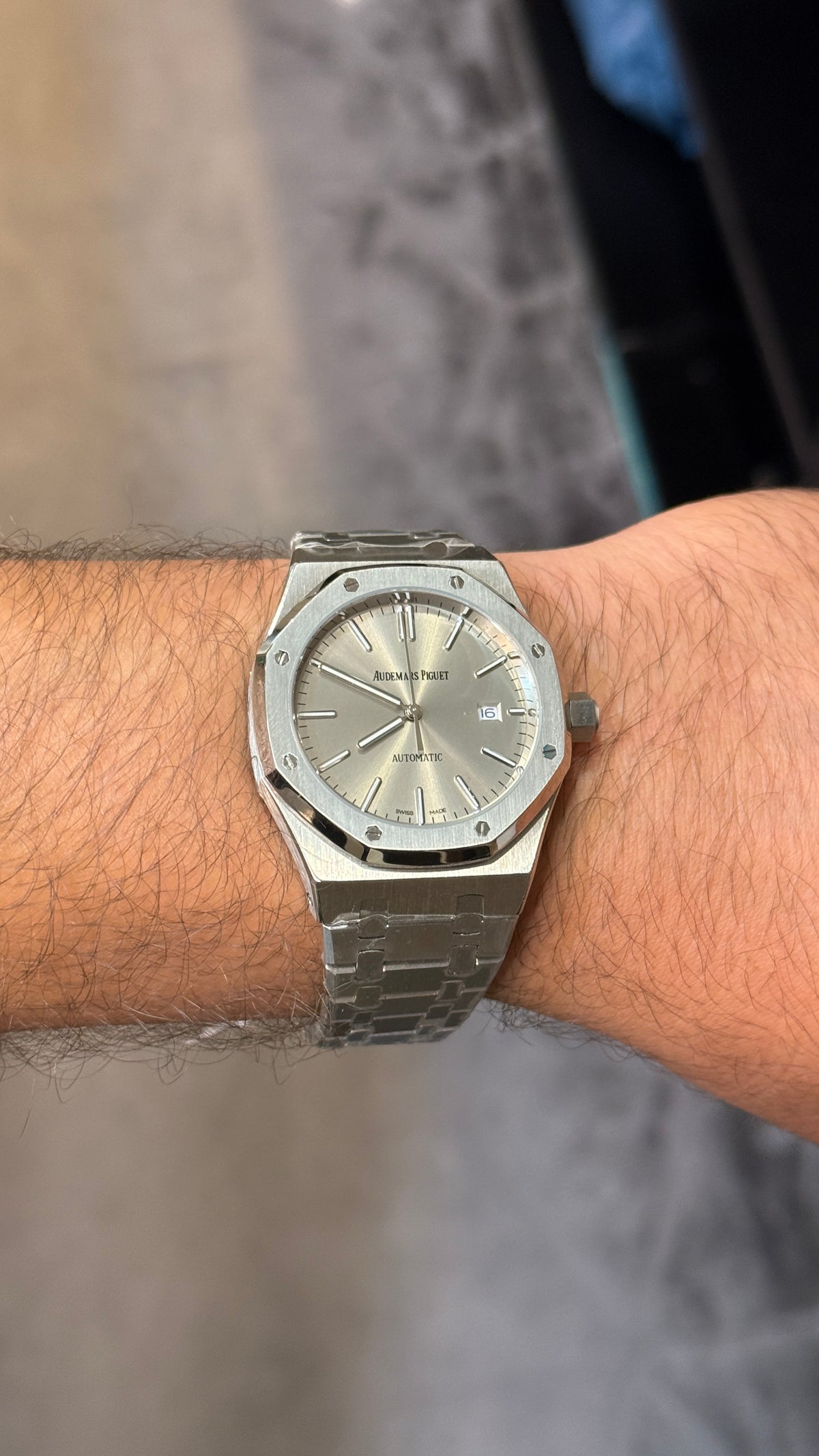 Silver with grey Dial.