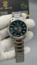 Silver with Green Dial.
