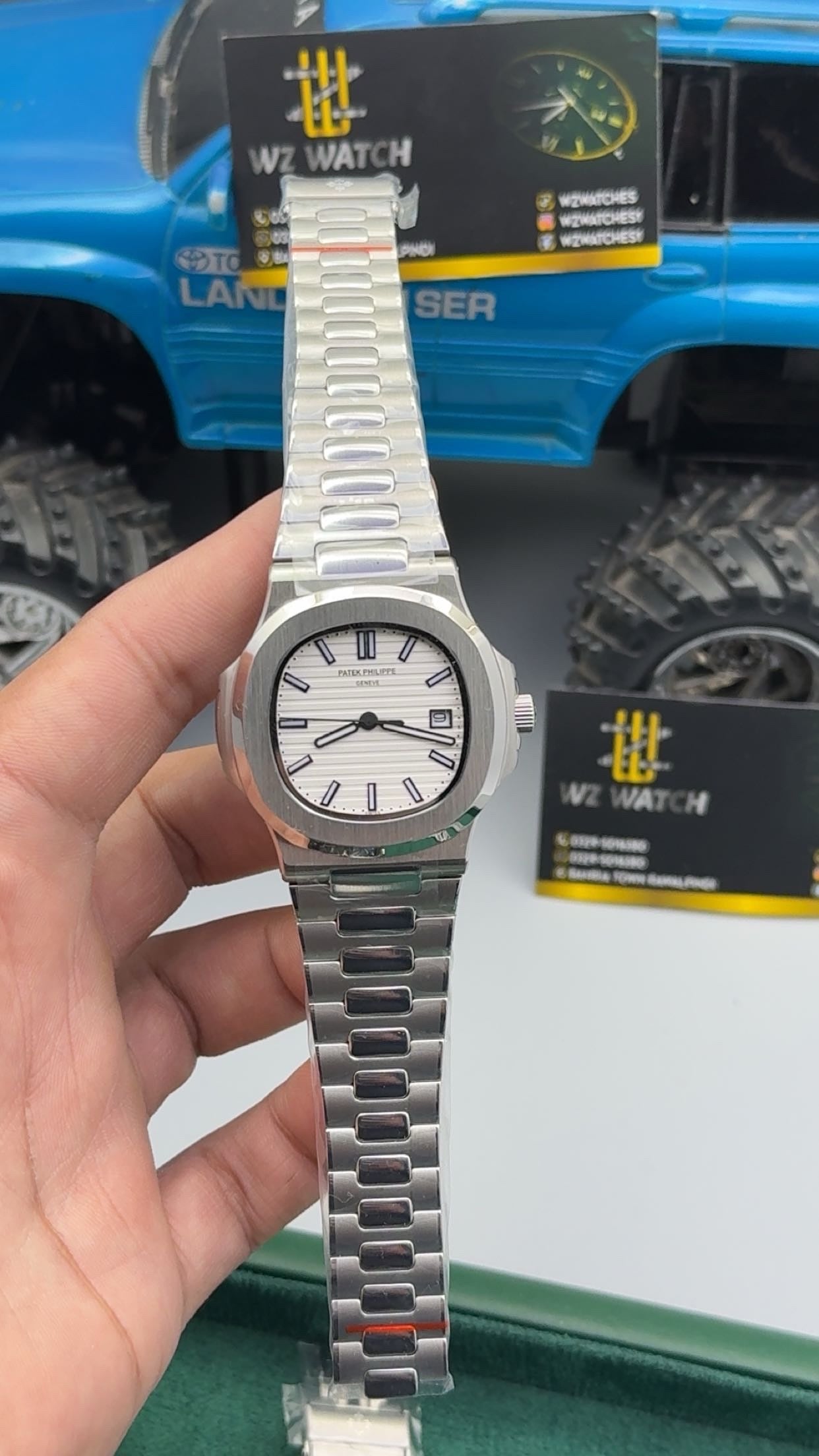 Silver with white Dial.