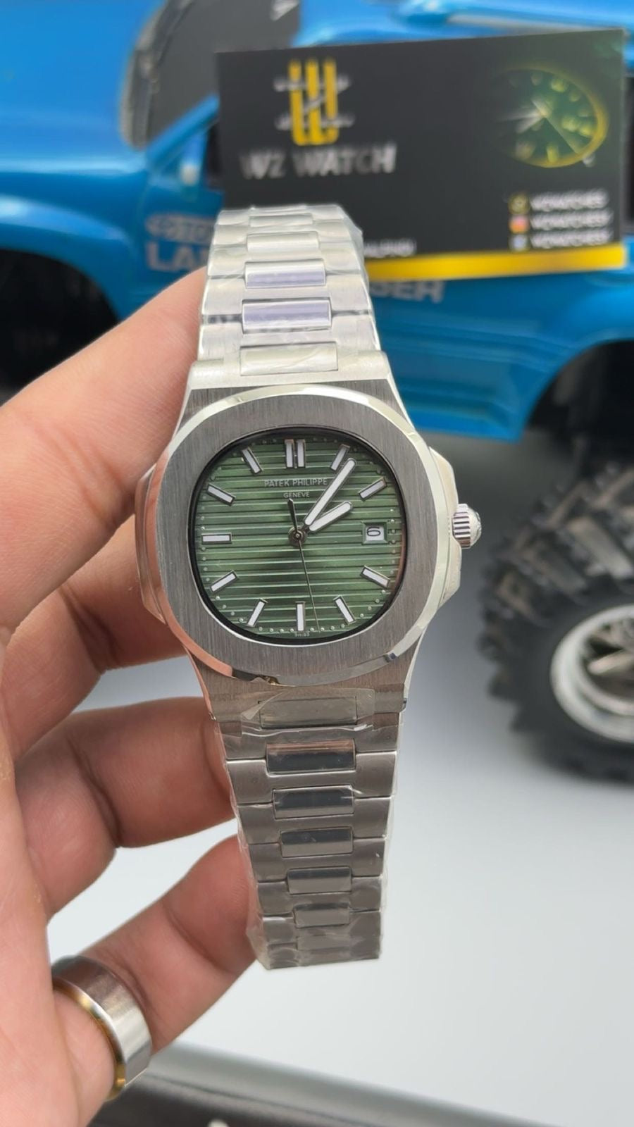 Silver with green Dial.