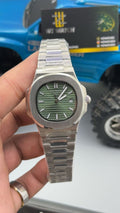 Silver with green Dial.
