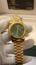 Yellow Gold with Olive Green Dial.