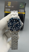Silver with blue Dial.