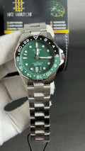 Silver with green Dial