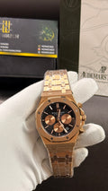 Rose gold with black dial