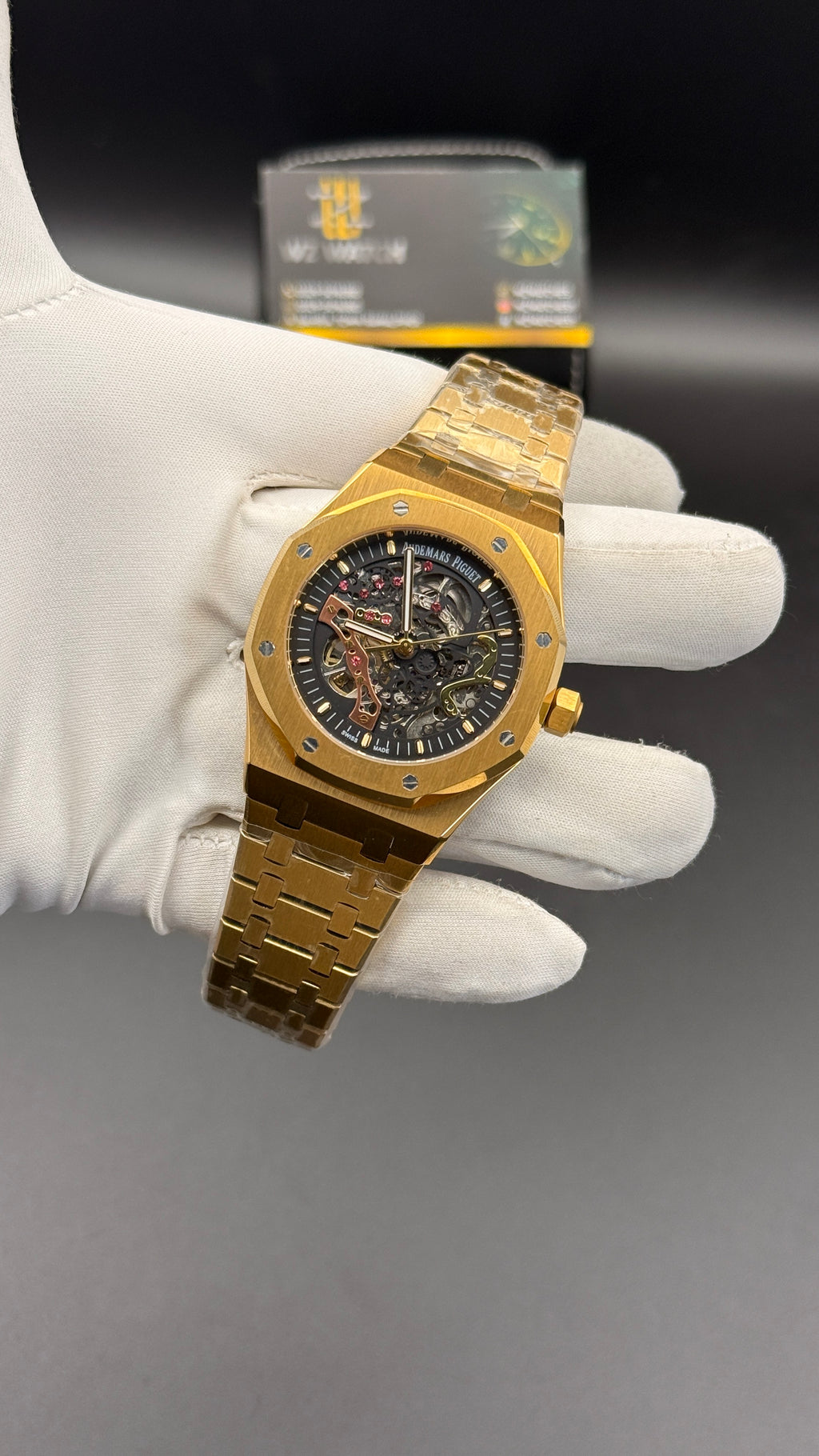 Yellow gold with black skeleton Dial.