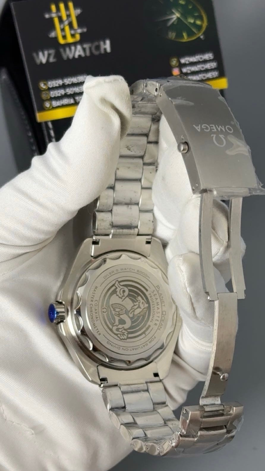 Silver with blue Dial.