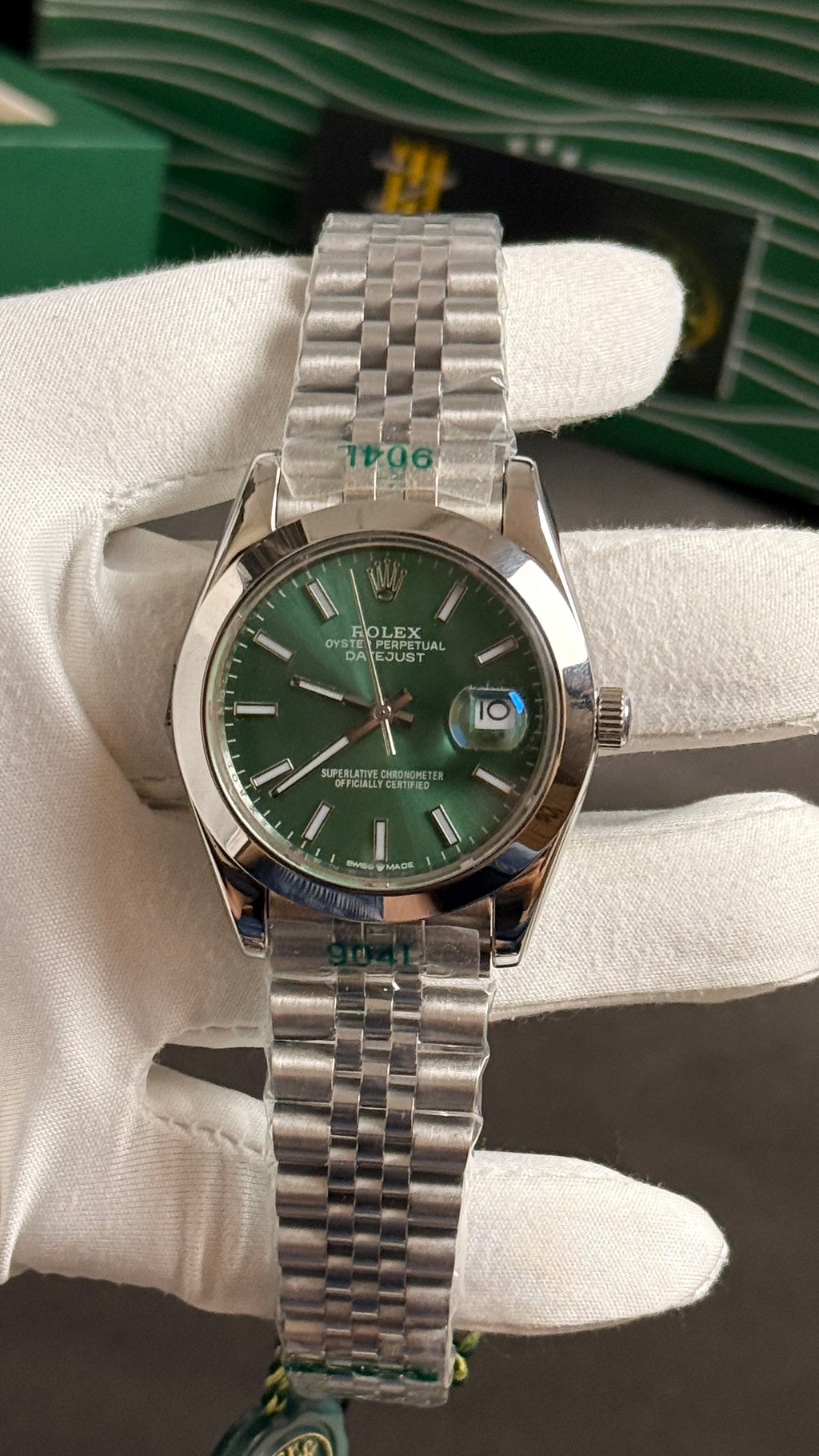 Silver with green Dial.