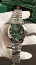 Silver with green Dial.