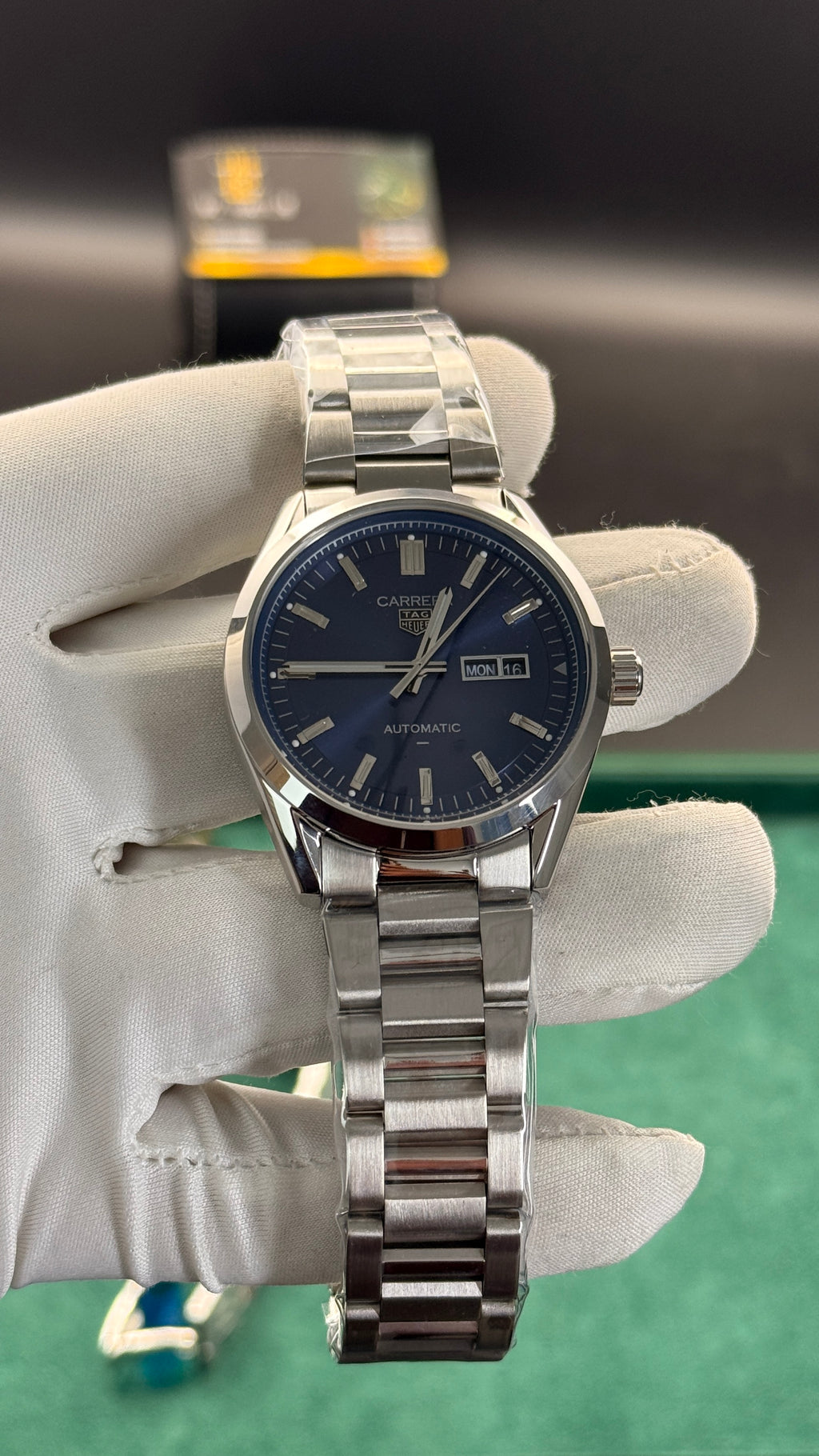 Silver with blue Dial.