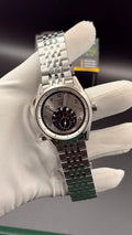 Silver with white Dial.