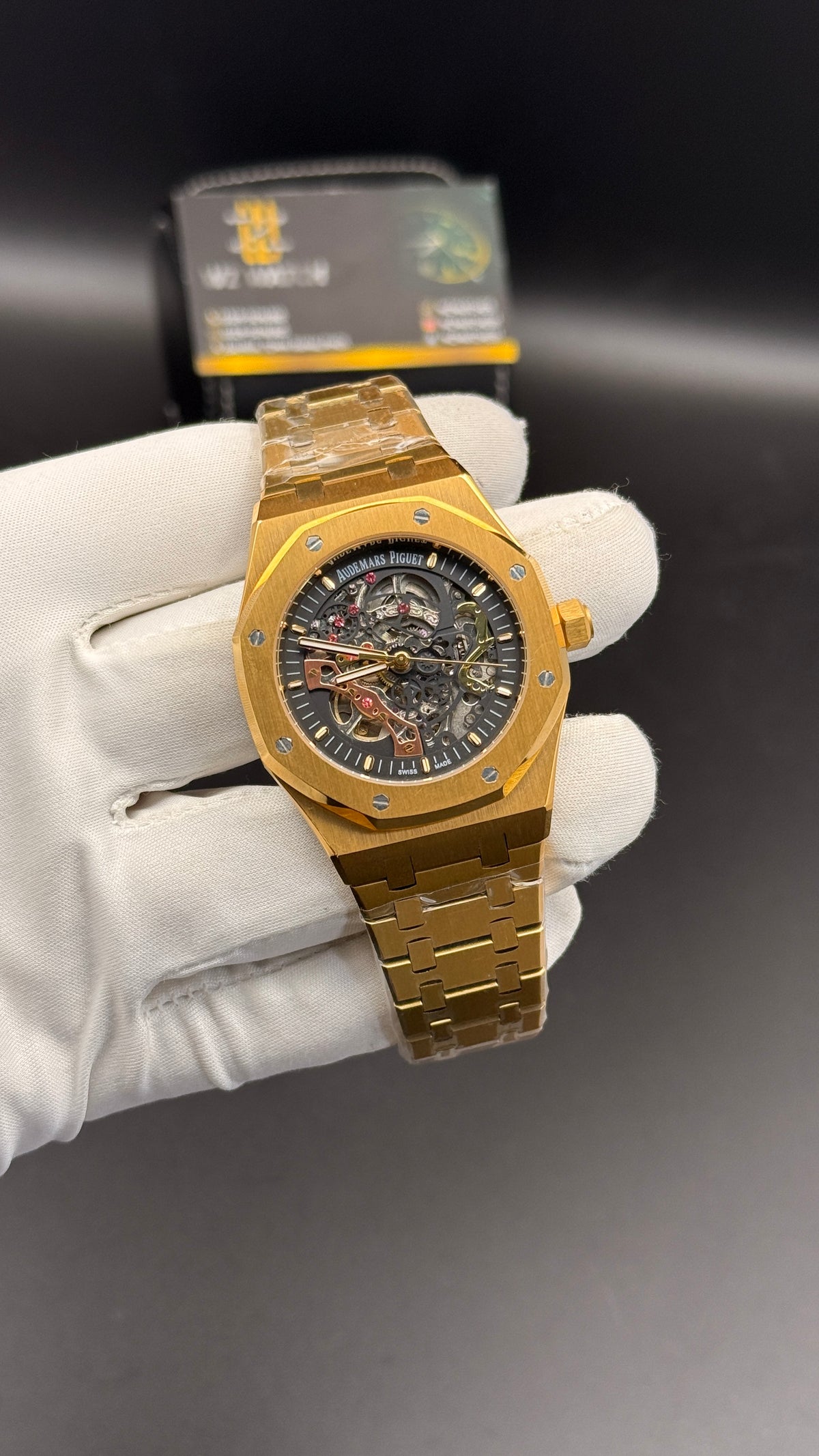 Yellow gold with black skeleton Dial.