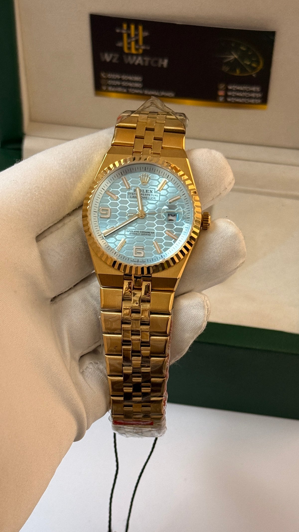 Yellow gold with sky blue Dial.