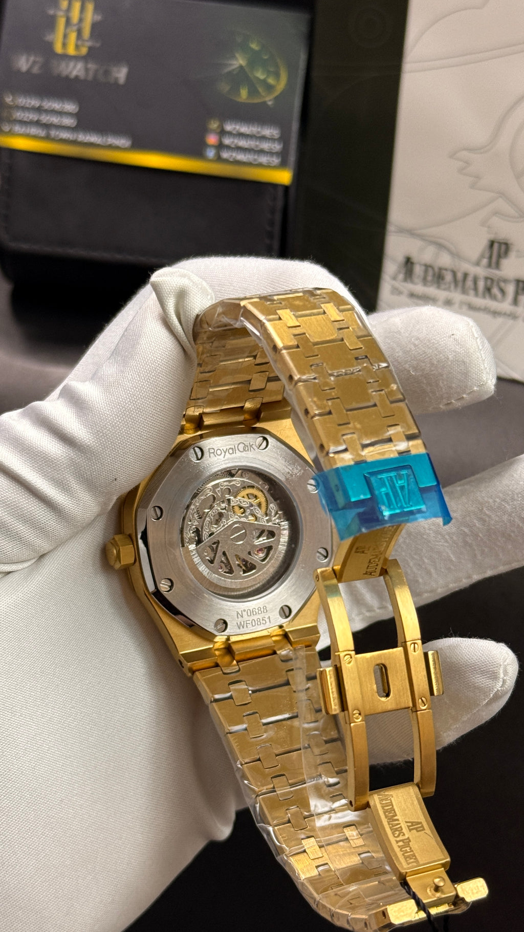 Yellow gold with black skeleton dial