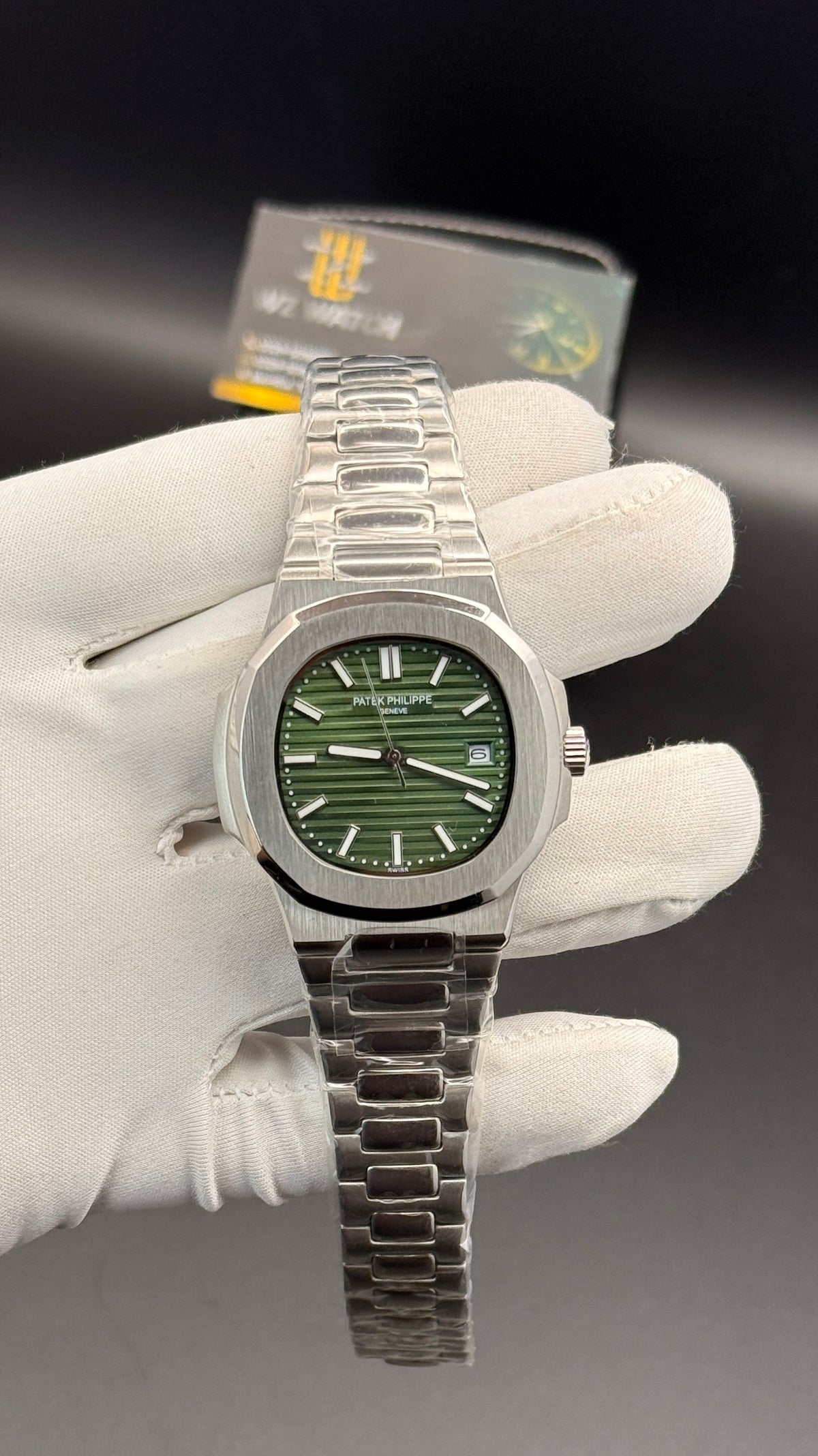 Silver with green Dial.