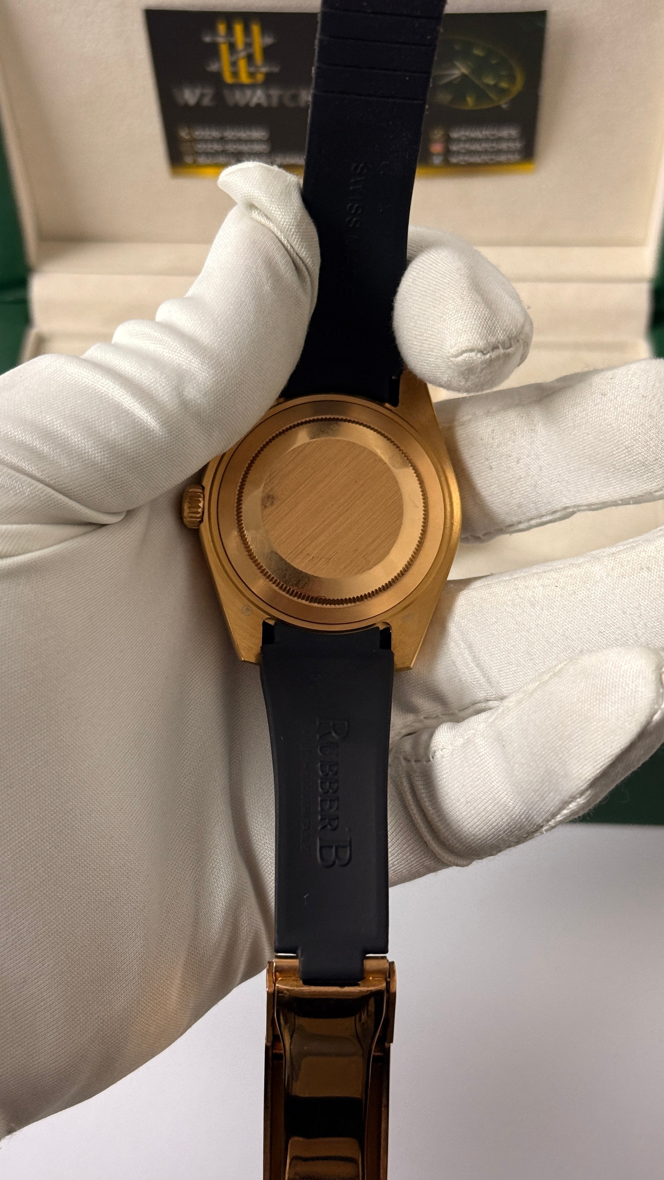 Rose gold with  Dark grey Dial.