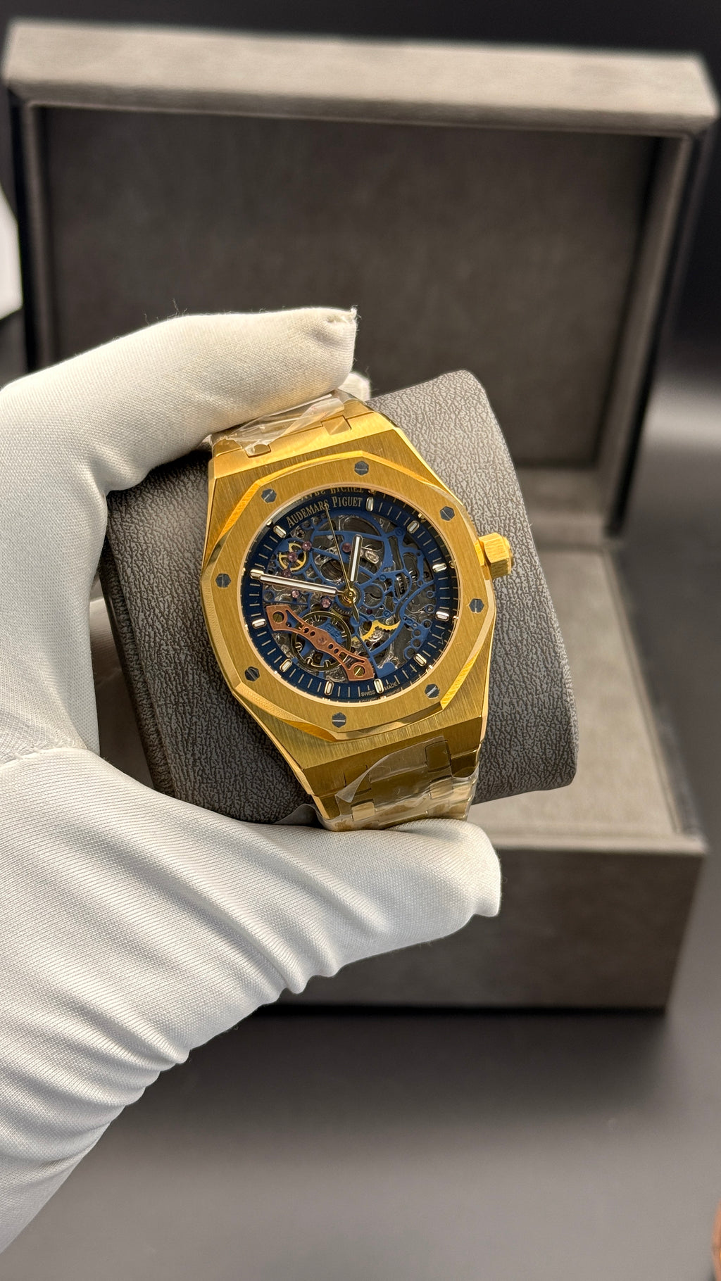 Yellow gold with blue skeleton Dial.