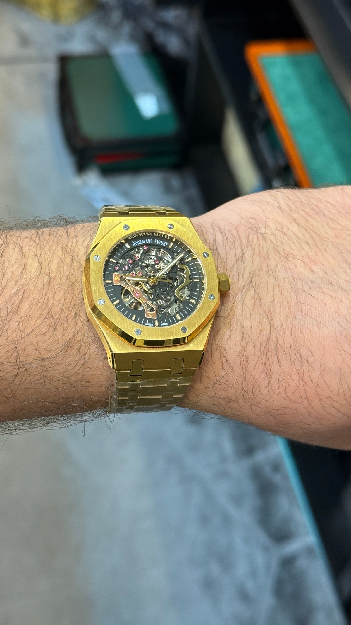 Yellow gold with black skeleton Dial.