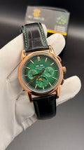 Rose gold with green Dial.