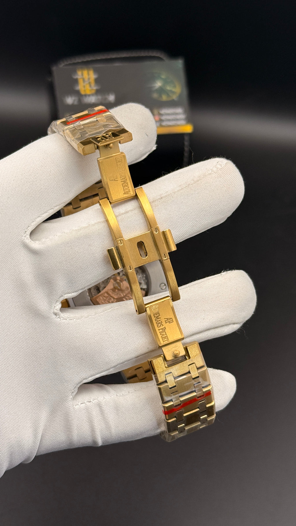 Yellow gold with black skeleton Dial.
