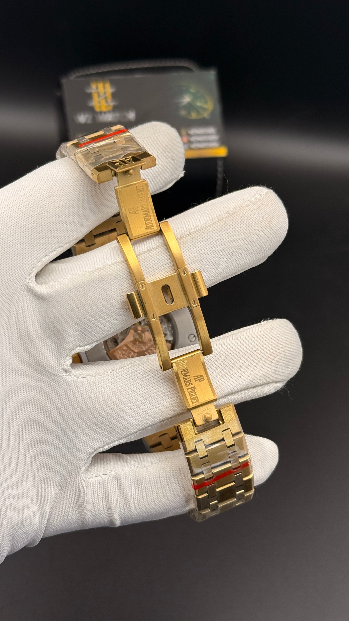 Yellow gold with black skeleton Dial.