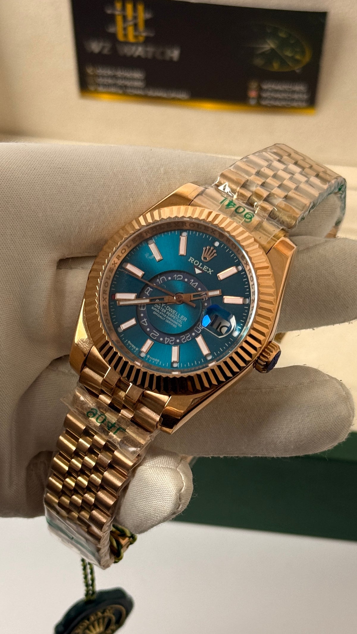 Rose gold with aqua Dial.