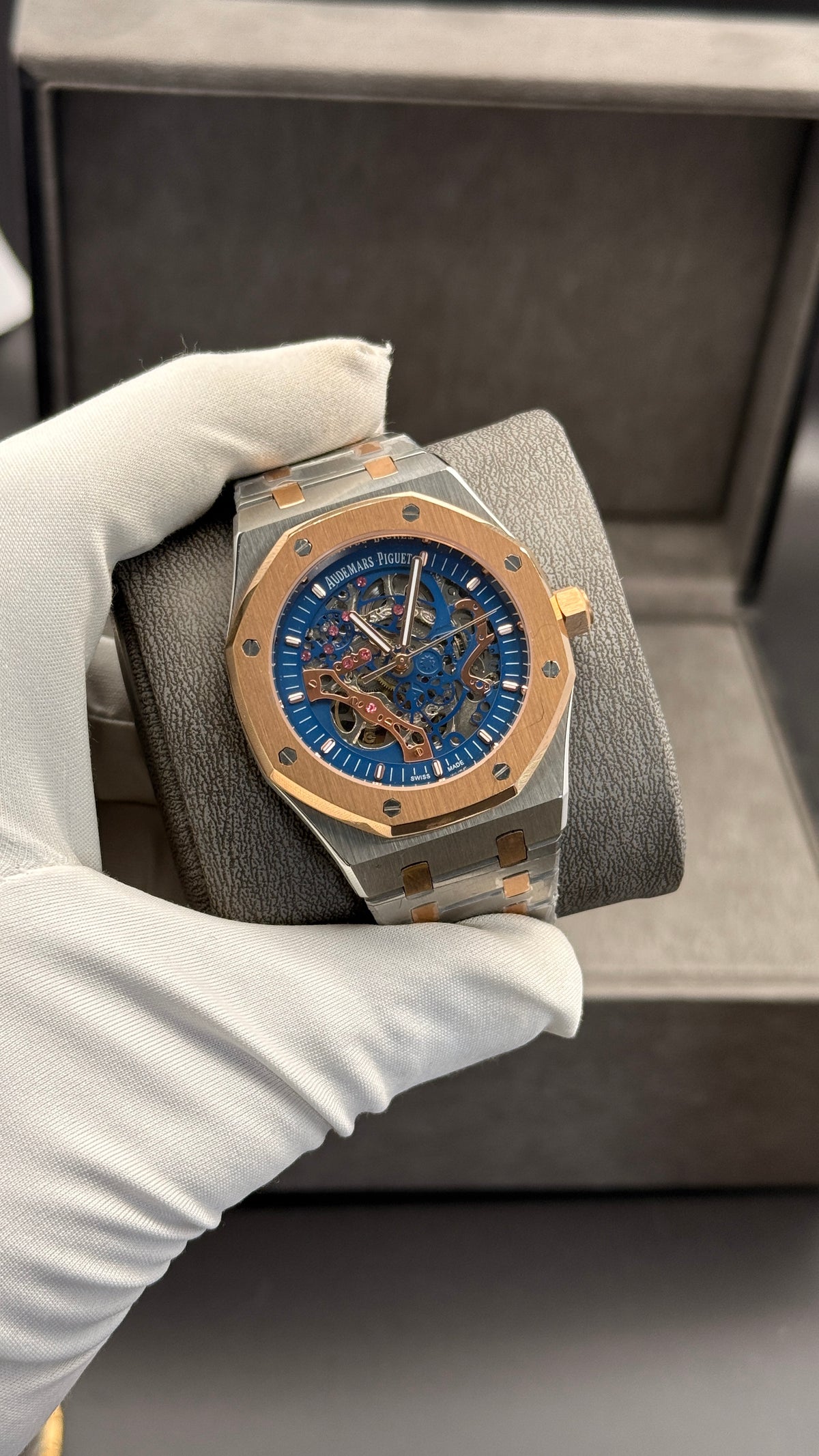 Rose gold two tone with blue skeleton Dial.