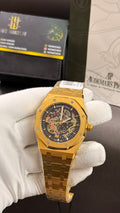 Yellow gold with black skeleton dial