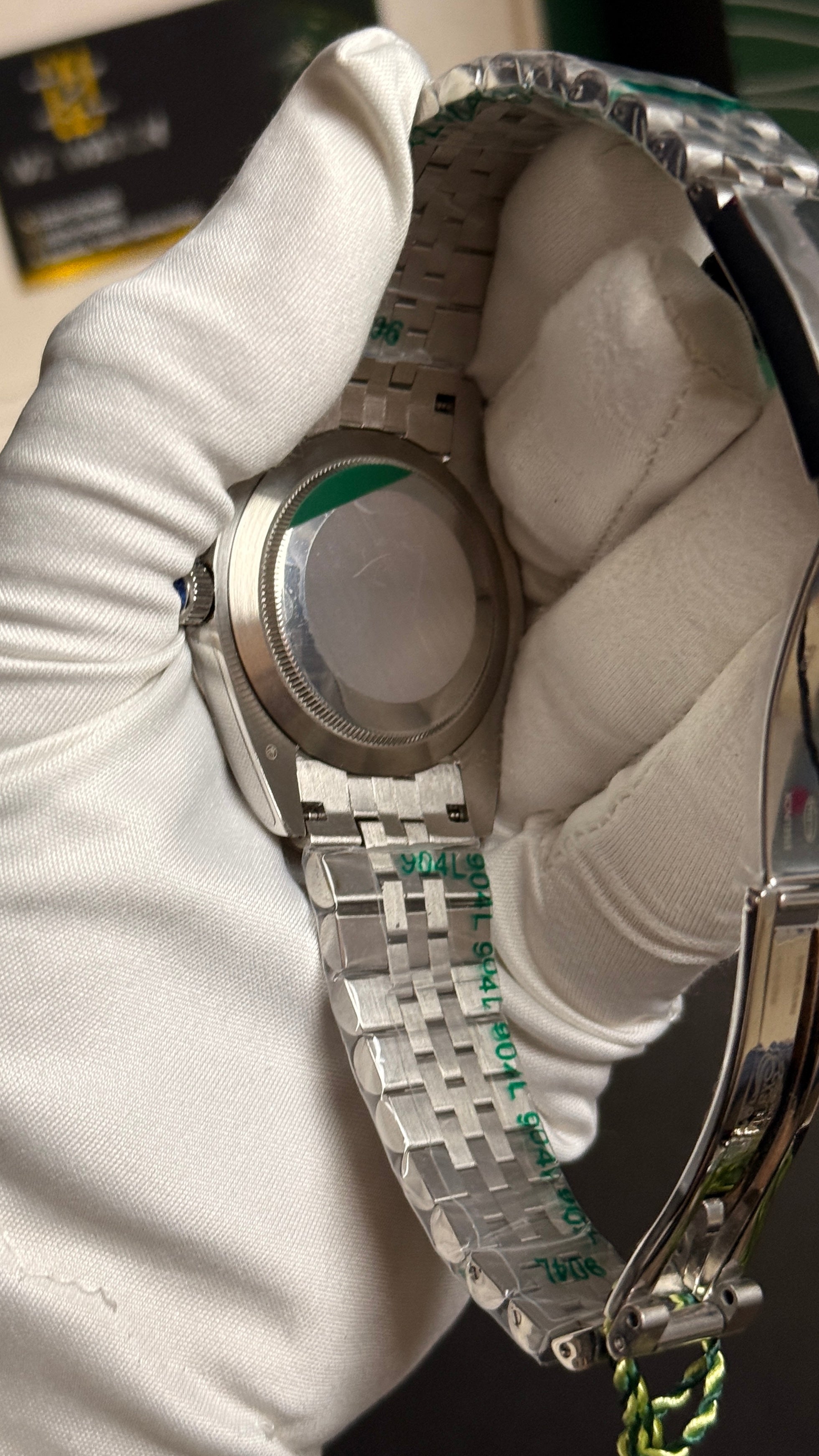 Silver with green Dial.