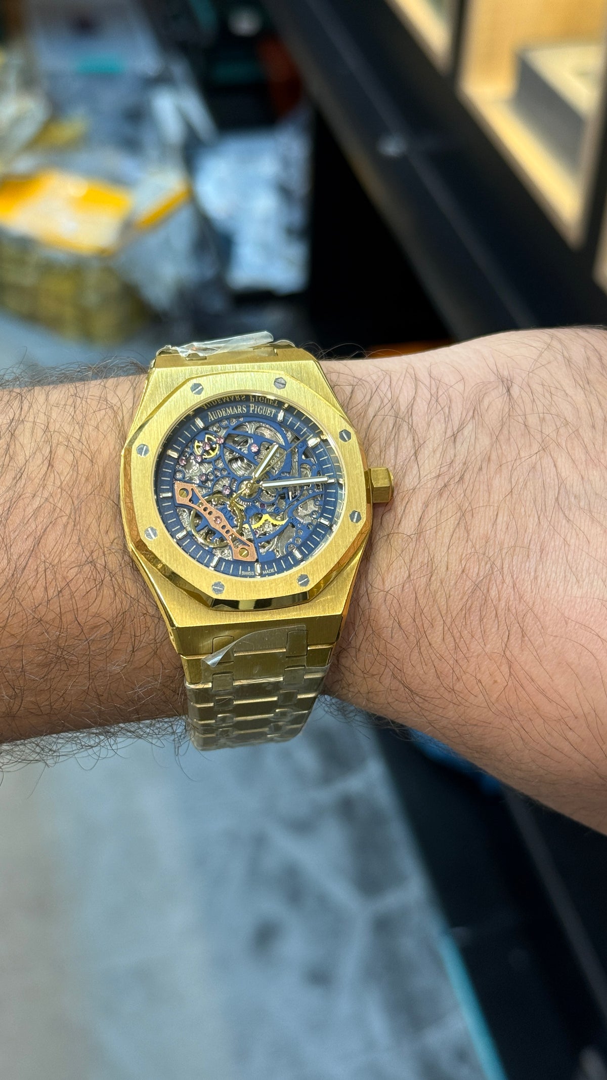 Yellow gold with blue skeleton Dial.