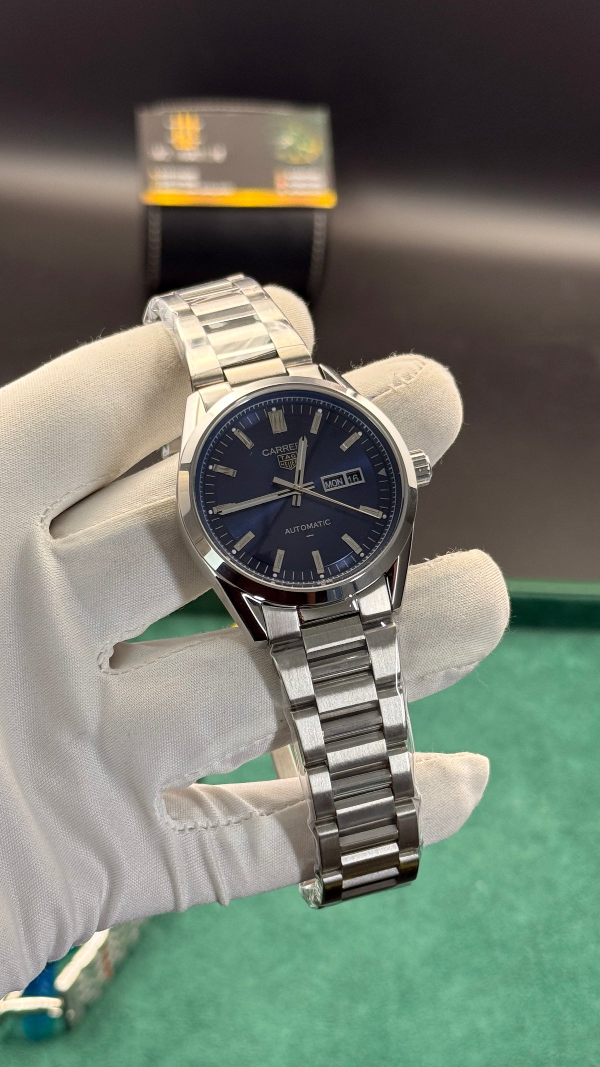 Silver with blue Dial.
