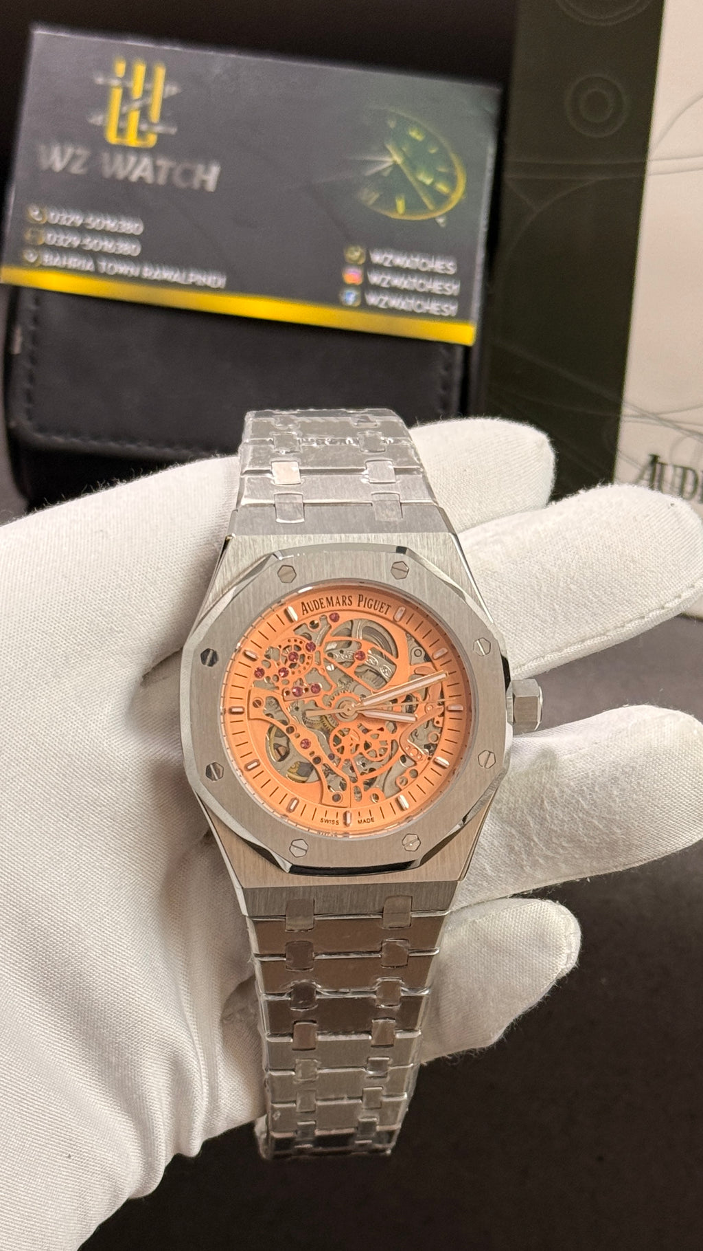 Silver with orange skeleton dial