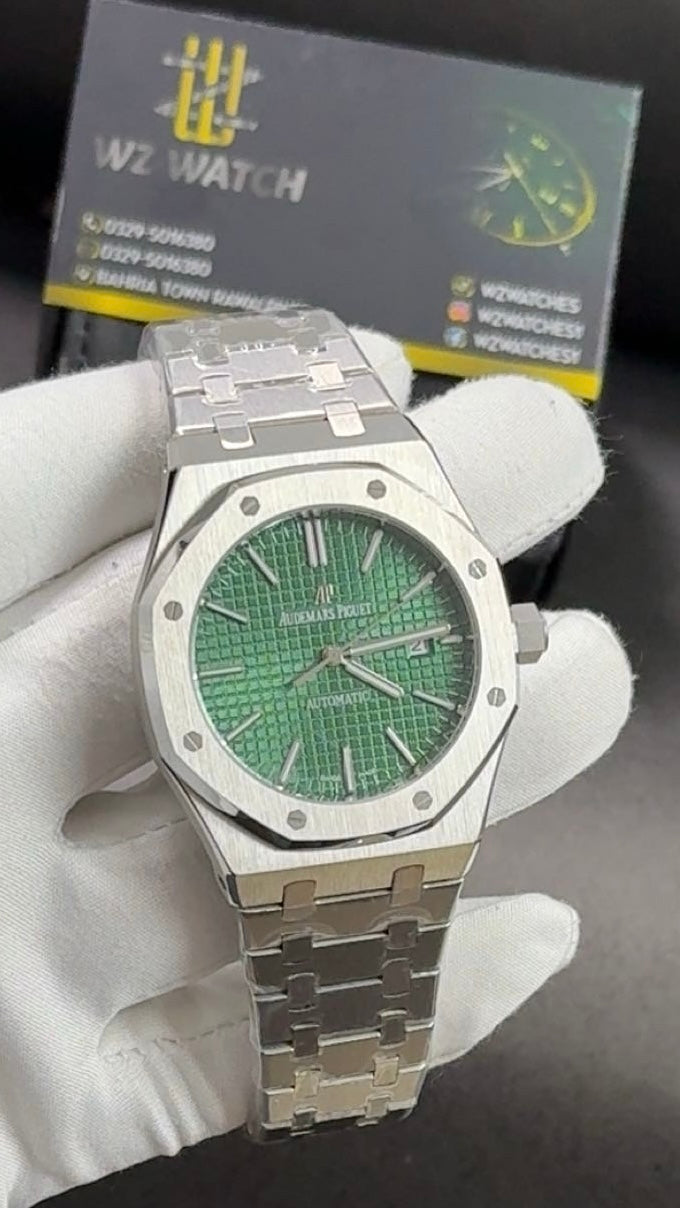 Silver with green dial