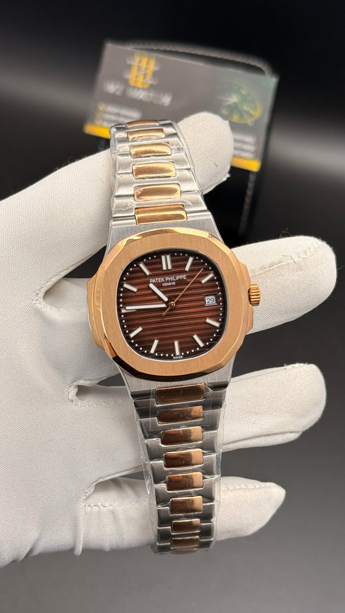 Rose gold two tone with chocolate Dial.