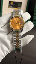 (36 mm) Yellow gold tow tone with Beauty Dial.