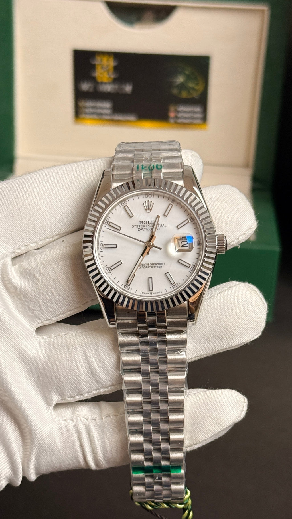 Silver with white Dial.