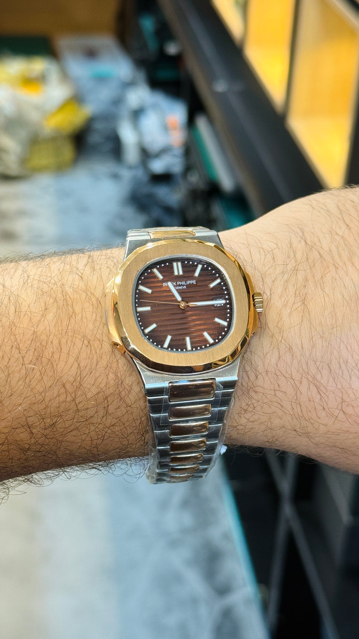Rose gold two tone with chocolate Dial.