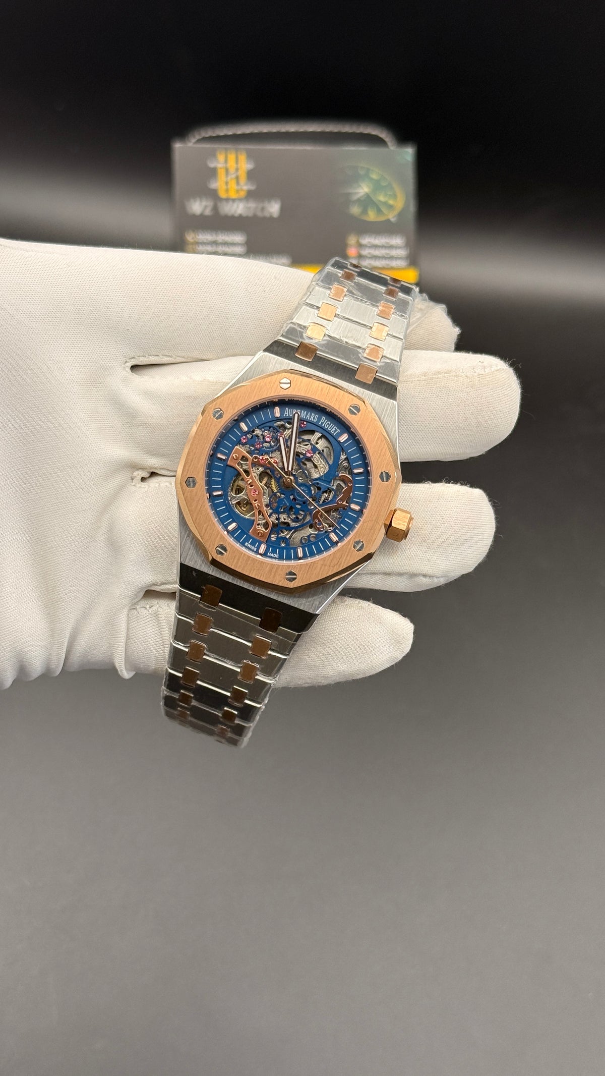 Rose gold two tone with blue skeleton Dial.