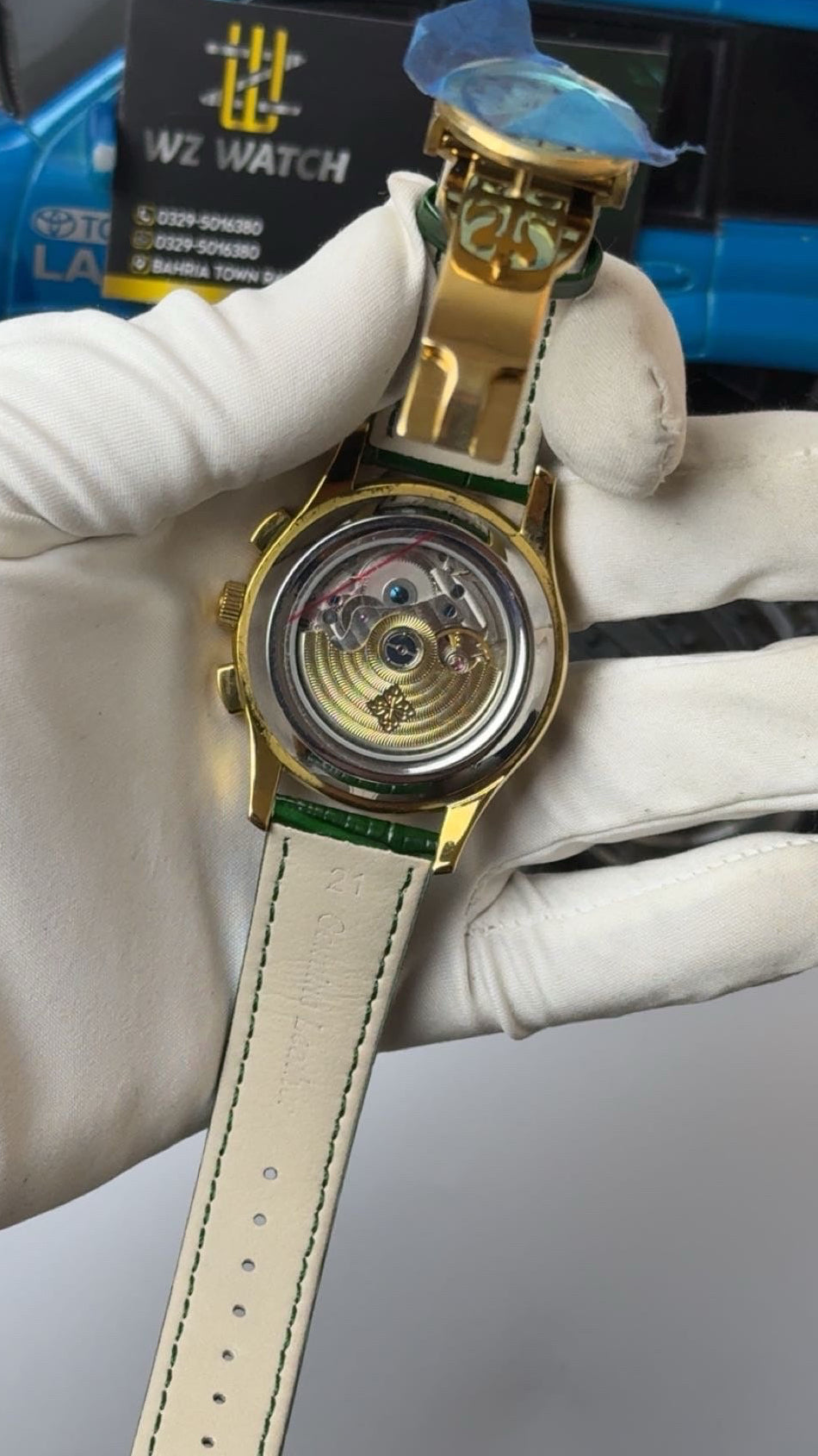 Gold with green Dial.