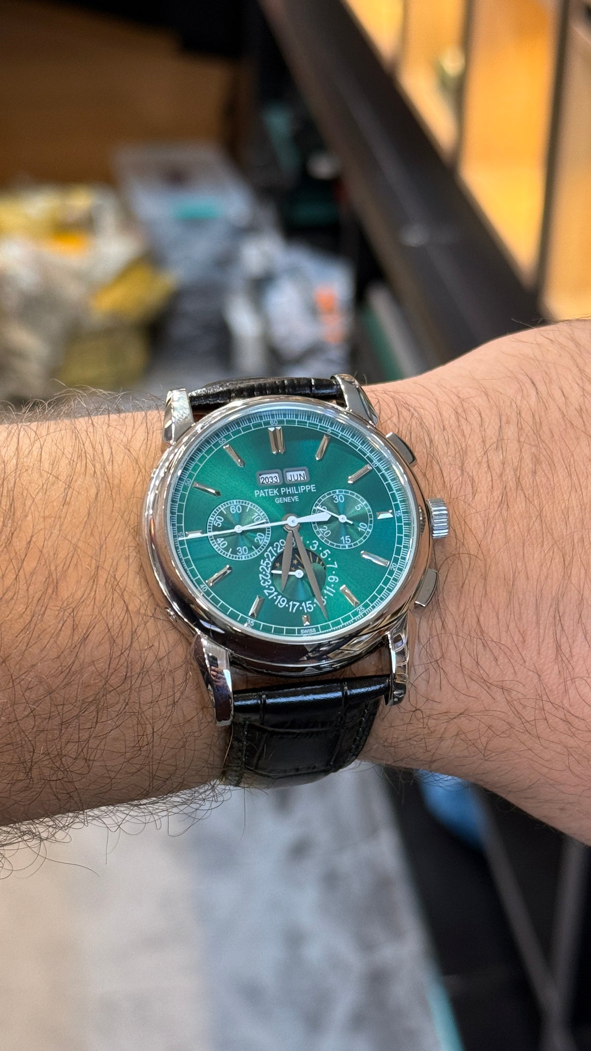 Silver with green Dial.
