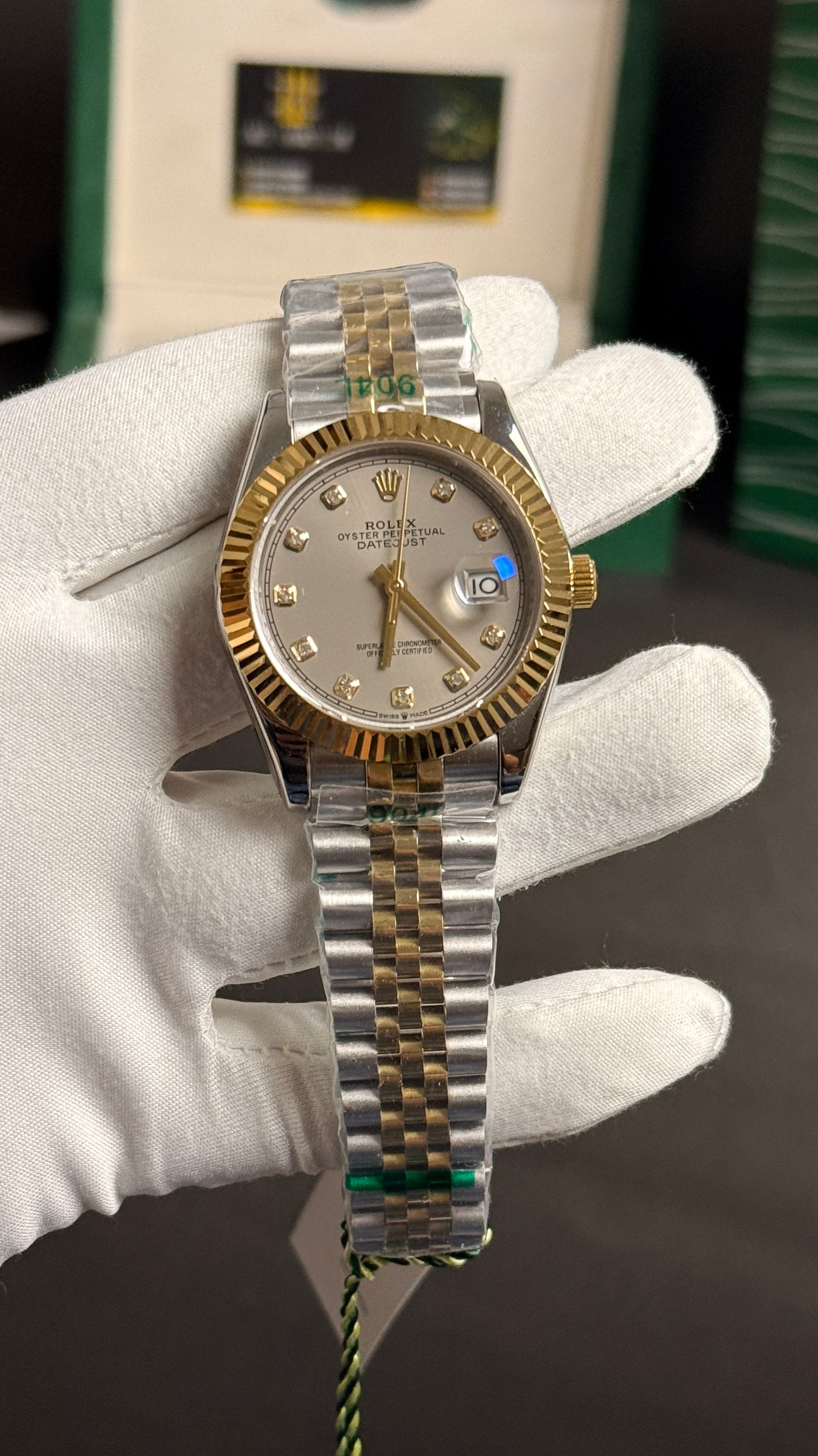 Yellow gold tow tone with grey Dial.