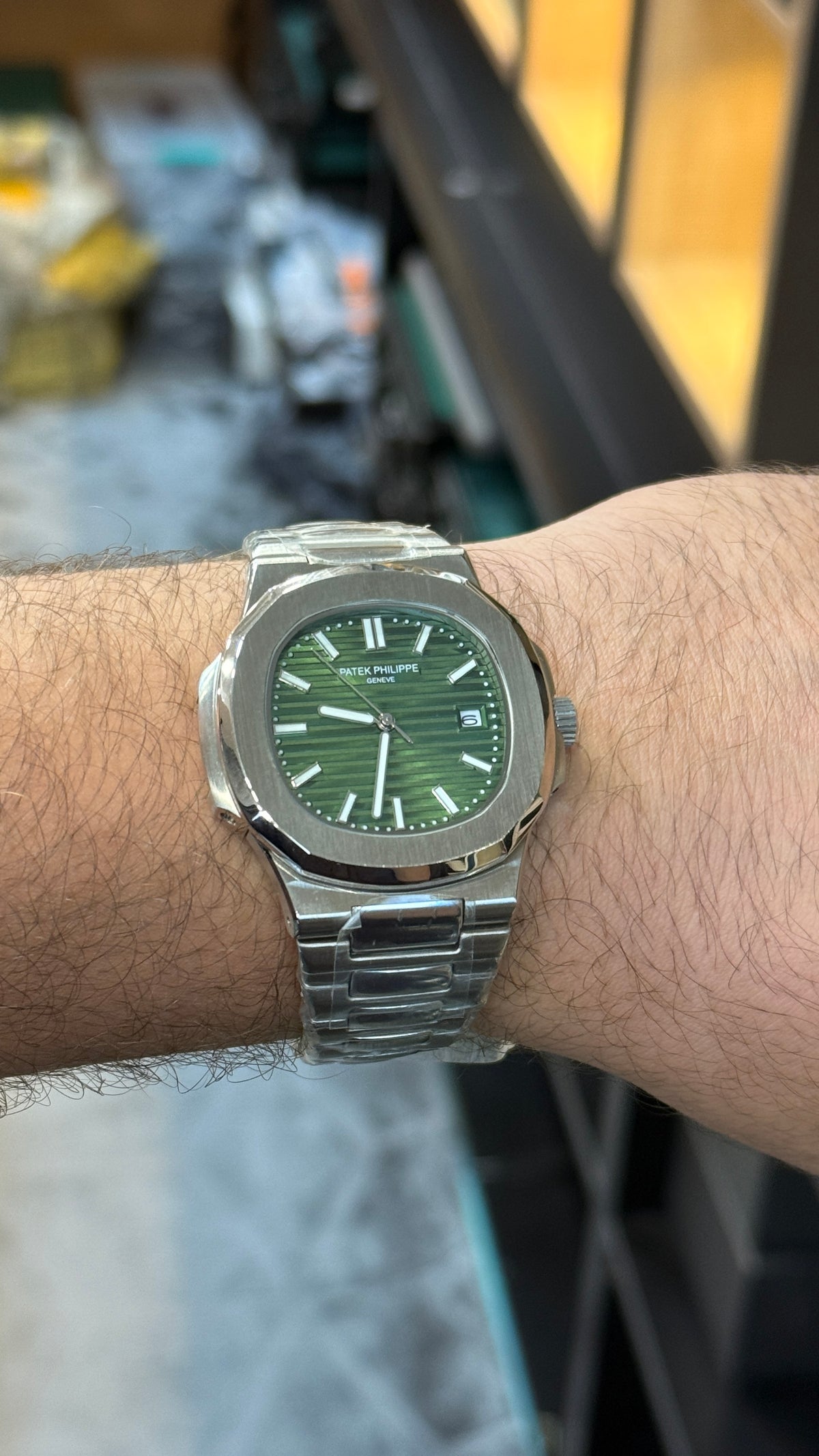 Silver with green Dial.