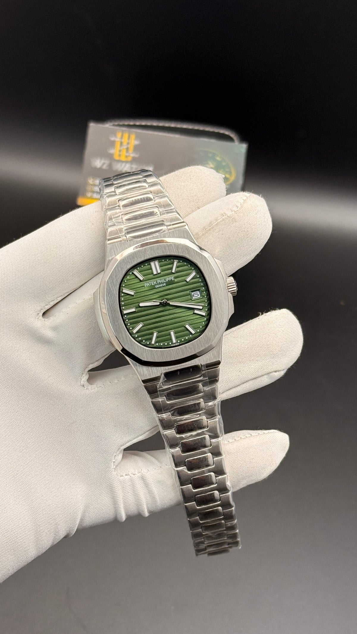 Silver with green Dial.